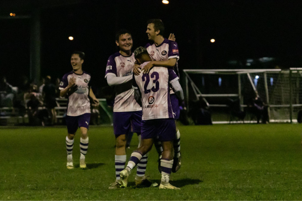 Southside Comets Player Ben Collins celebrates with his teammates after scoring a goal.