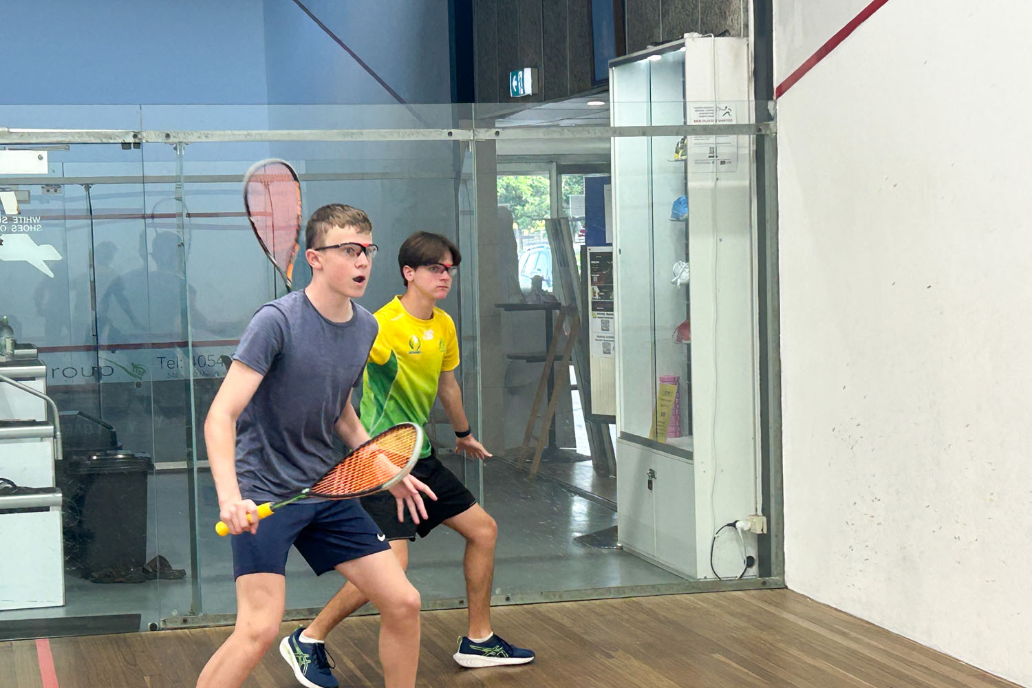 Cameron Ackroyd (left) and John Morris practise their skills at the Cairns squash courts at Genesis Sportsworld, which is hosting an international this week. Picture: Hugh Bohane