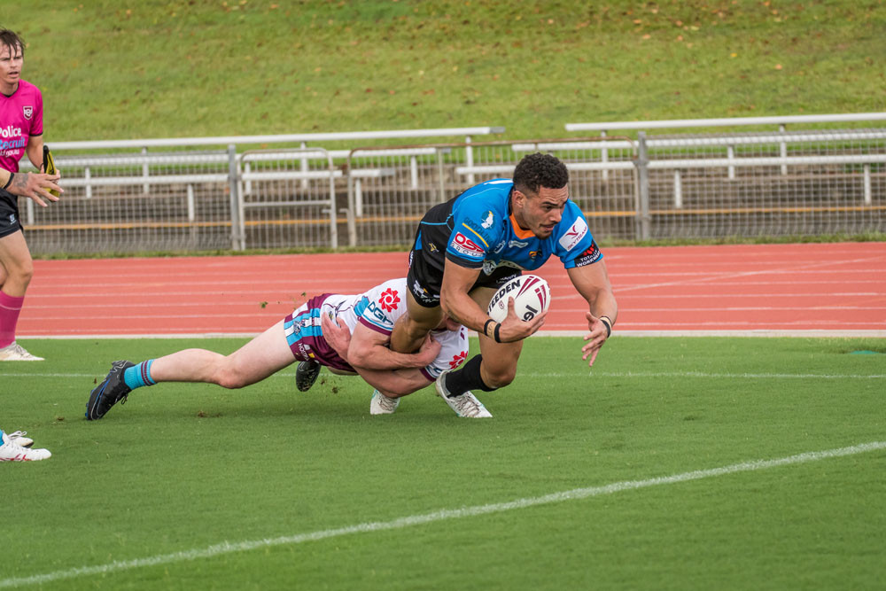 Robert Derby races forward in the match against Mackay Cutters.