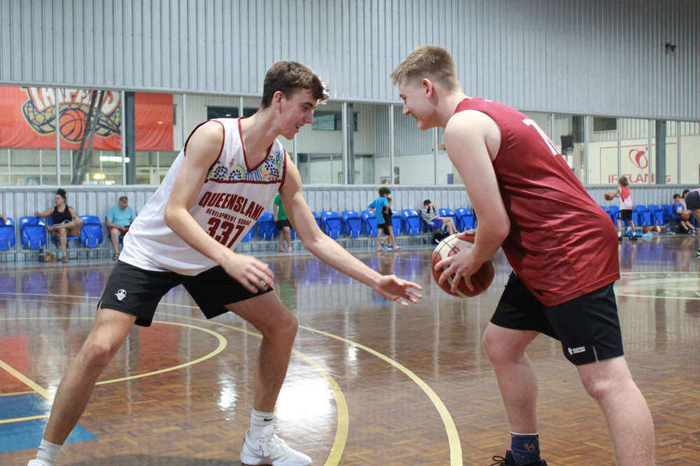 Saxon Toyne (left) and Joshua Hosking in action at the Aumuller St basketball courts. Picture: Isabella Guzman Gonzalez