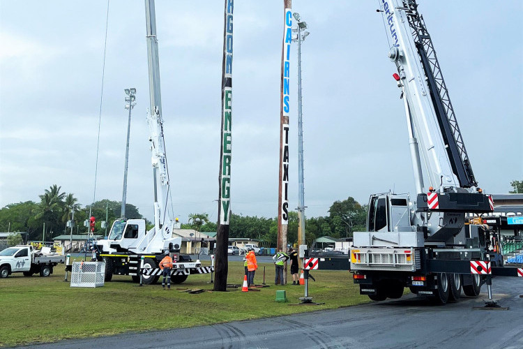 Century Cranes and SES crew erecting the climbing poles at the showground this week.
