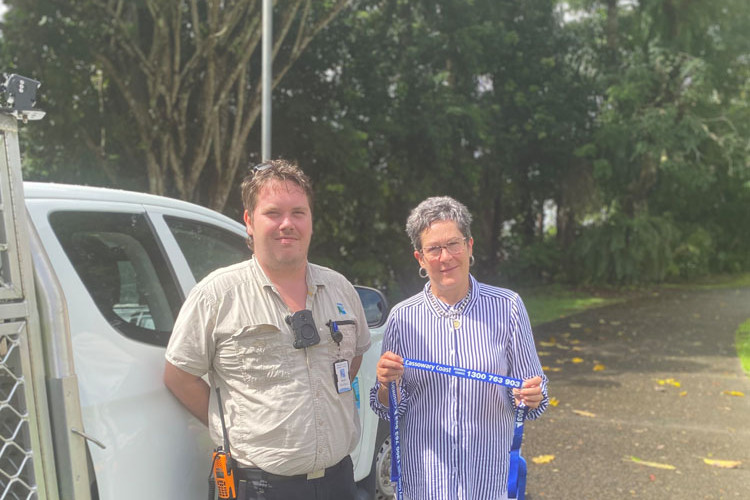 Mayor Teresa Millwood (right) and a council local law officer (name withheld) take the lead on responsible dog ownership. Picture: Cassowary Coast Regional Council