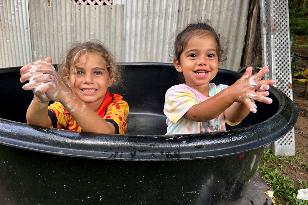 Avarie, 6, and Ariella Hari, 2, of Yarrabah are urging residents to be extremely hygienic as the Indigenous community battles Rheumatic Heart Disease (RHD).