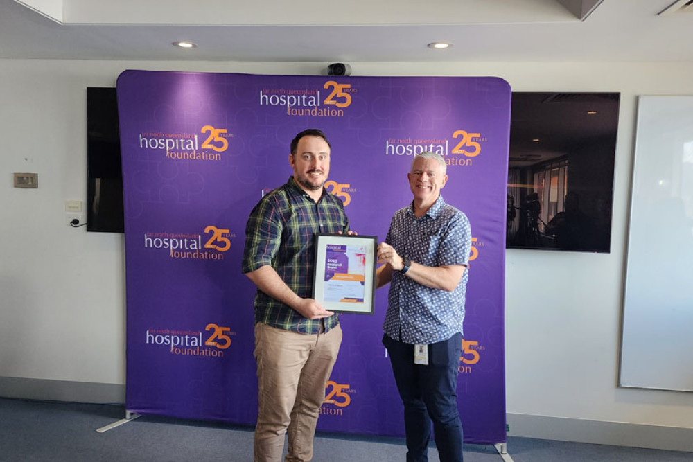 Physiotherapist Ben Glenwright receives a $50,000 grant for hip replacement rehabilitation research from Dr Edward Strivens.