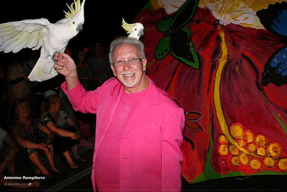 Davvyd ‘The Birdman’ Brown with his beloved cockatoo Henry and another cockatoo pal during the Port Douglas Carnivale in 2016. Pictures: Facebook