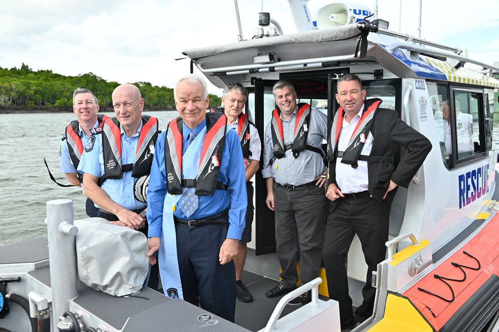 Marine Rescue Queensland chief officer Tony Wulff (left), Police Commissioner Steve Gollschewski, chaplain Peter De Hass, vessel captain Jim Branvich, Police Minister Mark Ryan and MP Craig Crawford on the newly-commissioned Trinity Rescue CS31. Picture: Isabella Guzman Gonzalez