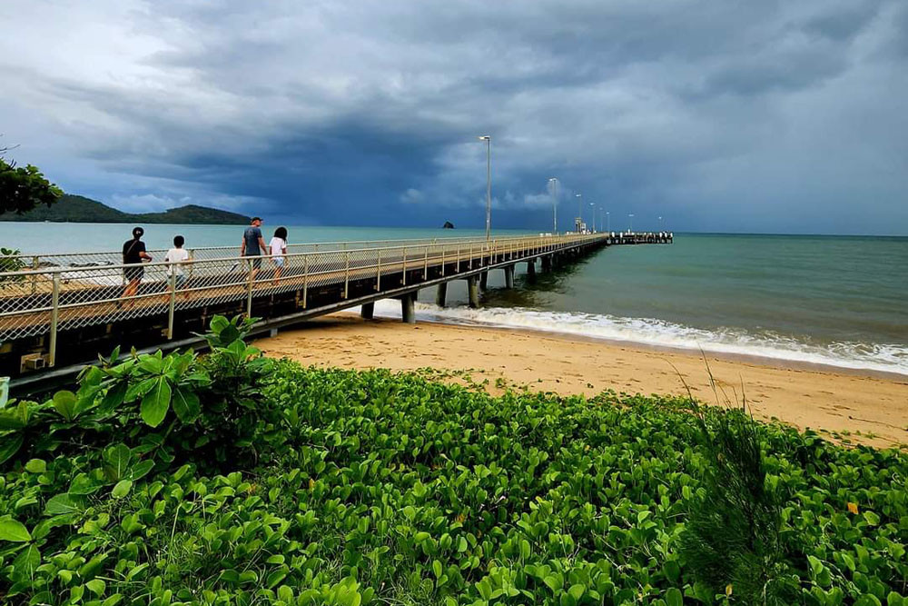 Palm Cove jetty as the clouds roll in. Plans are underway to make it a safe place for boats to dock in all weathers. Picture: Ross Palm