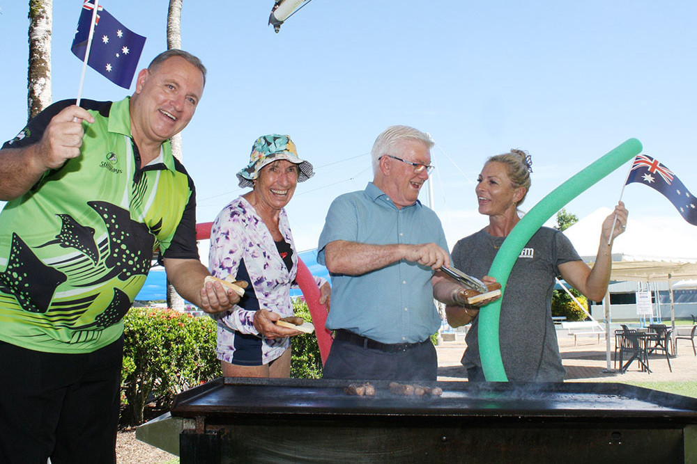 Ready for Australia Day activities at Woree Sports and Aquatic Centre are (from left) Cairns Stingrays Swimming Club president Jason Salecich, aqua aerobics participant Joy Brown, Cairns Mayor Terry James, and aqua aerobics instructor Karen Skudder. Picture: Cairns Regional Council