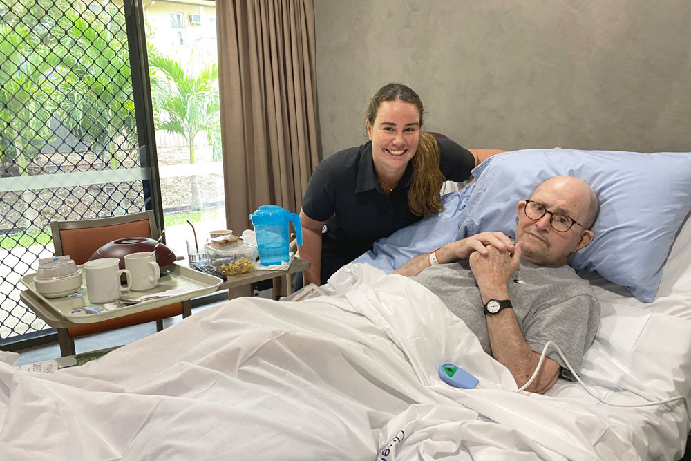 Graduate registered nurse Romy Turner with patient Fred Murphy in his room at the Edge Hill Orchards Lodge in Oregon St, Manoora (below)