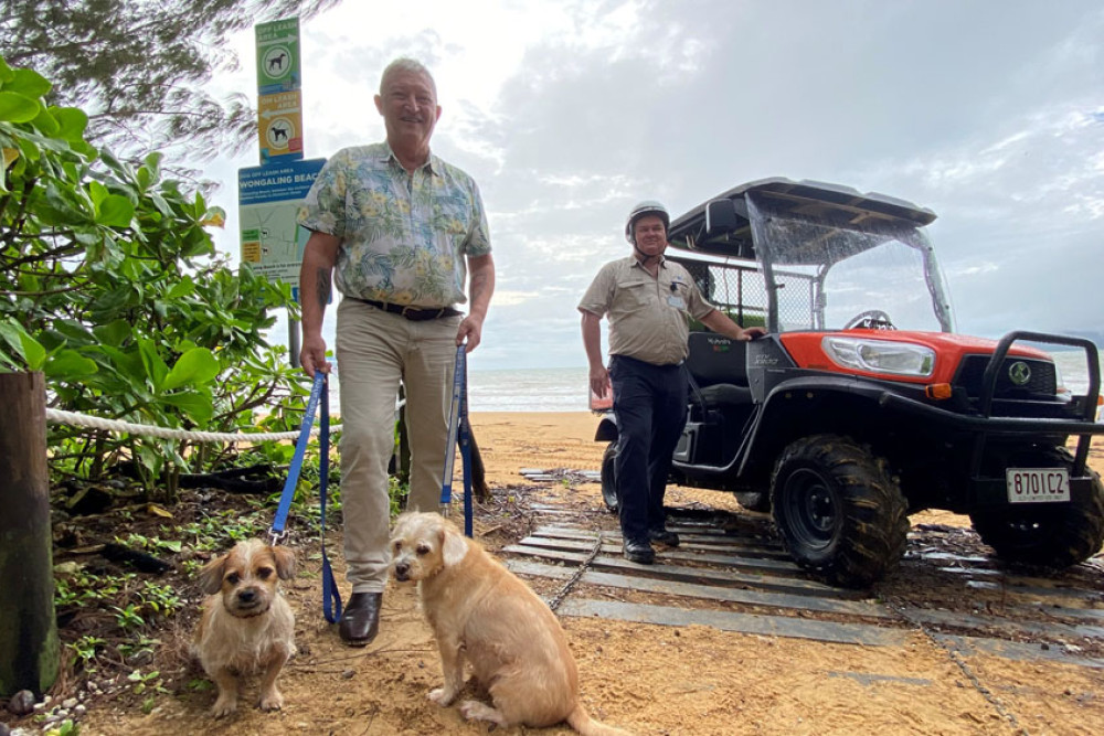 Cr Jeff Baines and local law officer Ian Morton with Motley and Fluke at the newly-signed Wongaling Beach dog off-leash area. Picture: CCRC