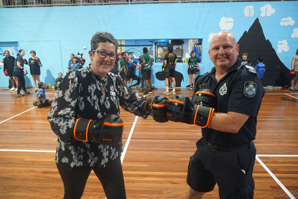Mayor Teresa Millwood with PCYC manager Sergeant Mick Macguire joining youth in the after dark drop-In boxing program. Picture: Cassowary Coast Regional Council