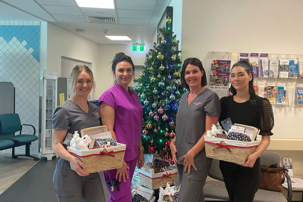 Injectables by Katy registered nurse Erin Herbert (left), Liz Plummer Cancer Centre acting nurse manager Emma Rose-Basha, Injectables by Katy owner Katy Hirst and Katy clinic manager Ashley Casa with the $600 gift baskets. Picture: Isaac Colman