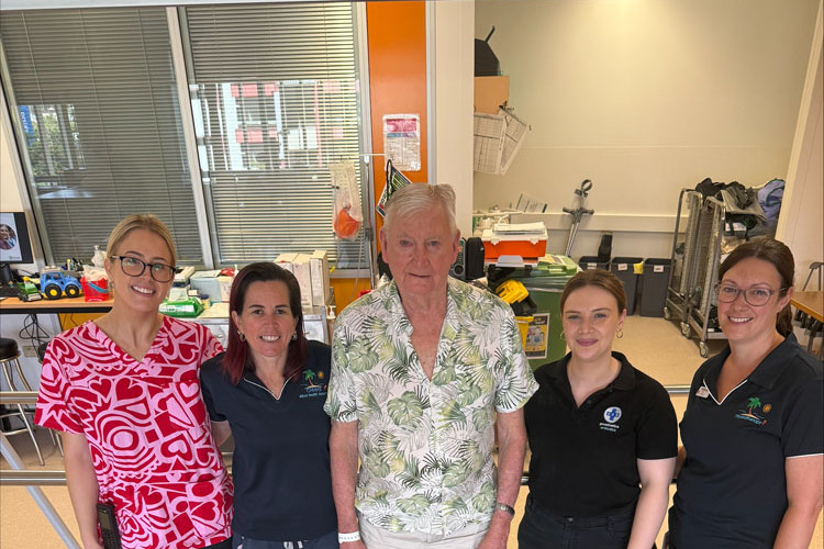 Colin Andreasson (middle) with members of the Cairns Hospital rehabilitation team. Picture: Cairns and Hinterland Hospital and Health Service
