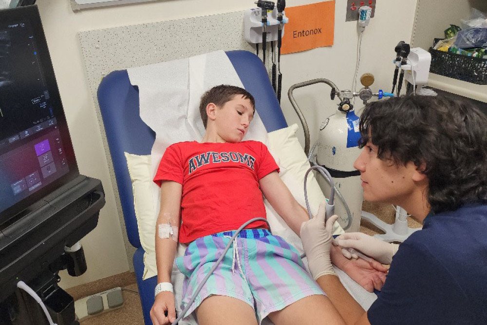 Cairns Hospital patient Harry Prior (left) is treated by paediatric ward's Dr Brandon Lo using the new ultrasound system. Picture: Far North Queensland Hospital Foundation