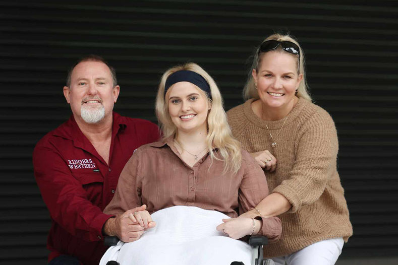 Daryl, Tiana and Della Gooding in Brisbane. Tiana is determined to finish her cancer treatment in time to do the 5km Bridge to Brisbane fundraising challenge, even on crutches. Picture: Supplied