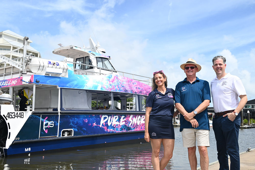 Master reef guide Michelle Barry, Pure Snorkelling director Alan Wallish and TTNQ CEO Mark Olsen with the new Pure Snorkelling boat at the Cairns Marina. Picture: Isabella Guzman Gonzalez