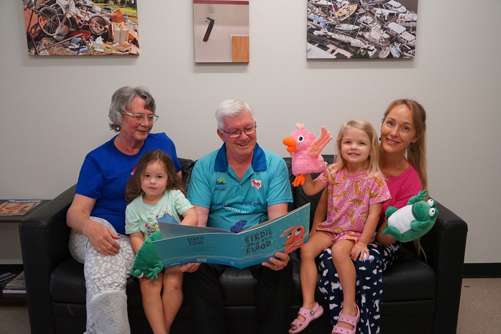 Deputy mayor Terry James (centre) reads one of the books to Pyjama angel Lucy Pedersen, Jasmine Hinds, Willow Paterson and Pyjama angel Lucy Friends. Picture: Cairns Regional Council