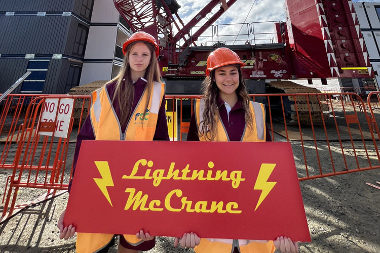 Year 9 Woree State High School students Mika Sullivan (left) and Teliah Isa won a competition to name a crane next door to the school. Picture: Supplied
