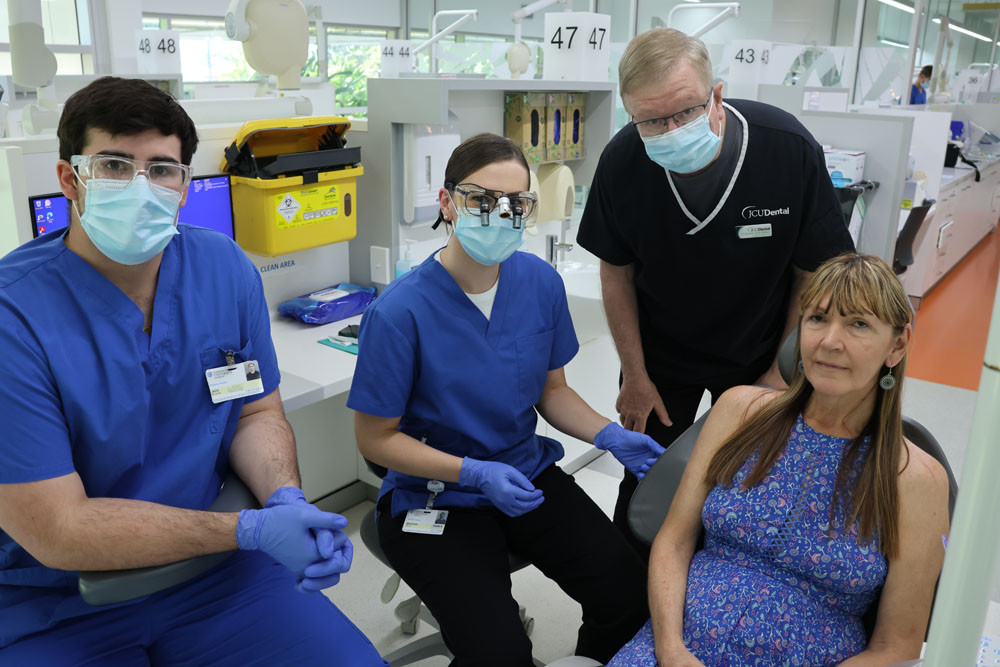 Fourth year JCU Dentistry students Jack McCamley (left) and Meaghan Mannix, JCU director of clinical studies Professor John Abbott and patient Sharon Rowe at the dental clinic in Cairns.