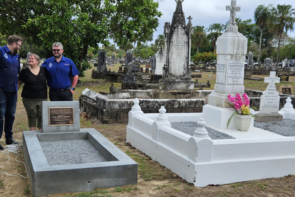 Linda Bristow (centre), the great niece of Evan Whiting killed in the 1918 Kuranda rail tragedy, thanks Australian Federated Union of Locomotive Employees’ state secretary Mick McKitrick (left) and president Anthony Woodward for the new grave. Picture: Nick Dalton