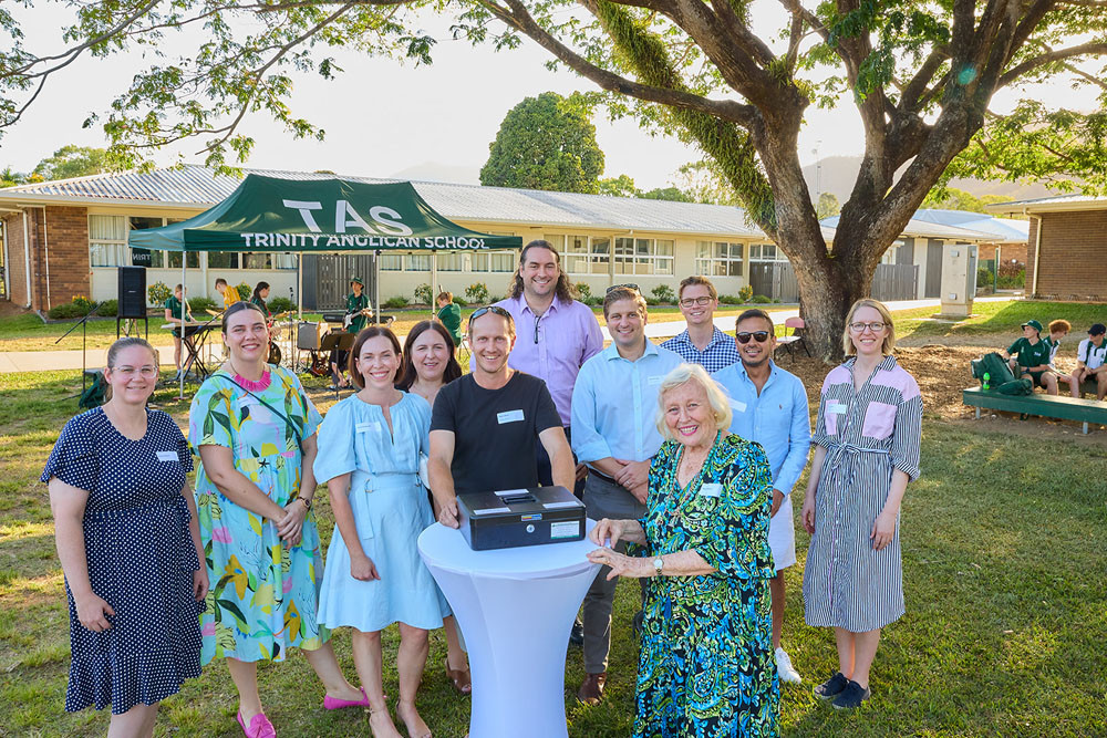 TAS alumni from 2003, (from left) Tracey Dangaard, Kate Chapman (nee Agar), Paula Zangrande (nee Newman), Rebecca Collins, Mark Leitner, Patrick Donald, Darren Boule, Murray Moule, Ankur Sinha, and Kate Smith. The school’s co-founder, Naomi Wilson is pictured at front opening the time capsule. Picture: Romy Photography