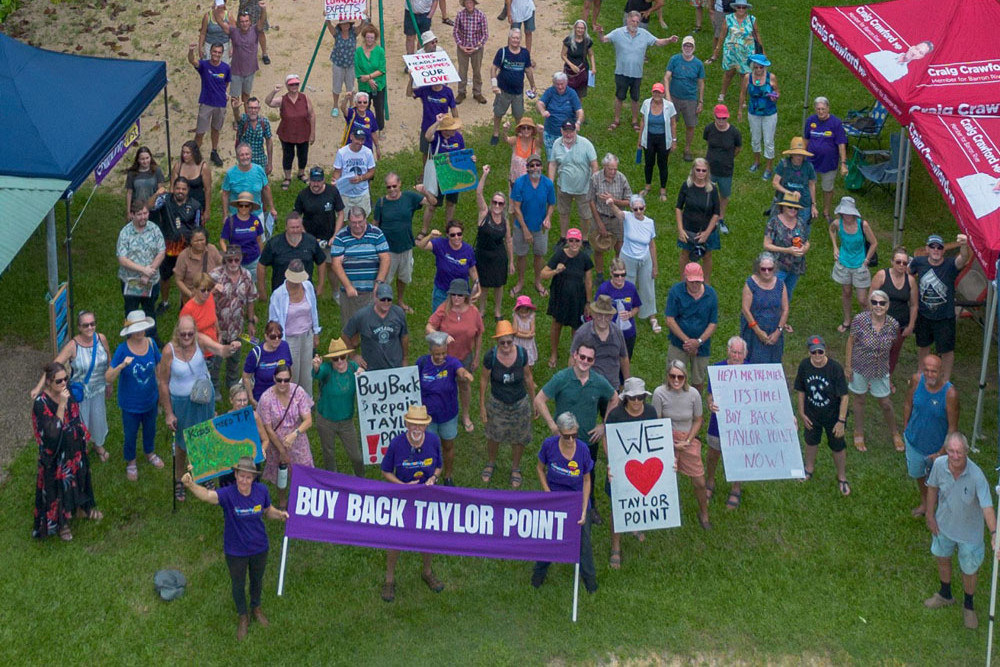 Members of Community First with residents at last Saturday’s rally to push the state government to buy back Taylor Point at Trinity Beach. Picture: Community First