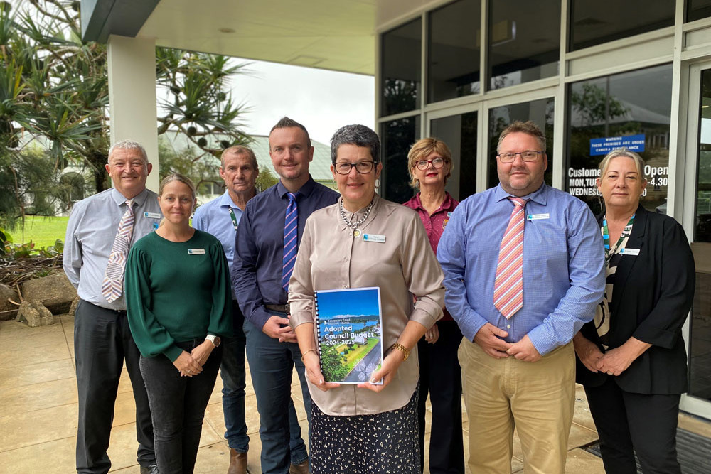 Mayor Teresa Millwood (centre) presents the Cassowary Coast 2024/25 budget with (from left) Cr Jeff Baines, Cr Renee McLeod, Cr Peter Reed, chief executive officer Andrew Graffen, Cr Trudy Tschui, Cr Nicholas Pervan and Cr Ellen Jessop.