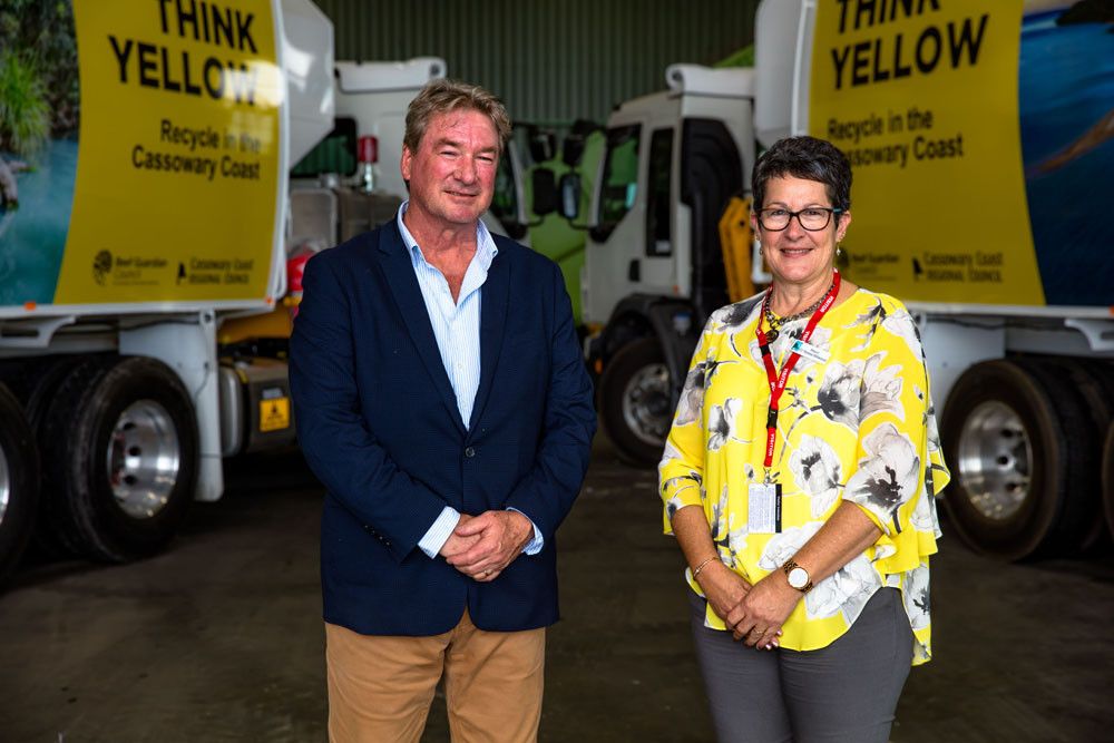 JJ’s Waste general manager David Colvin and Cassowary Coast Mayor Teresa Millwood with the new ‘yellow’ trucks. Picture: Cassowary Coast Regional Council