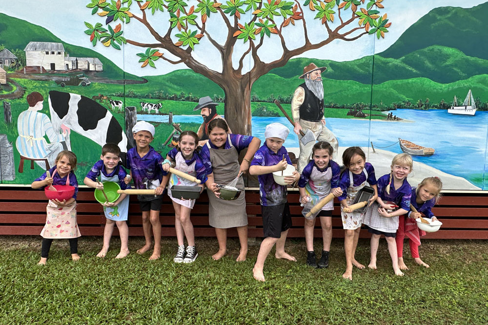 Daintree State School students Tia Welham (left), Chase Mulley, Harlex Weier, Thea Mulley, Bailee Weier, Braxton Wilkins, Lara Mulley, Emily Torenbeek, Rayna Wilkins and Ayana Toth posing in front of the centenary mural. Picture: Supplied