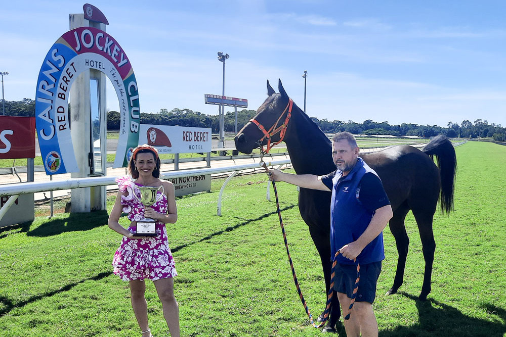 Cairns Central resident stylist Bella Nucifora with trainer Stephen Massingham and racehorse Lidder Valley at Cannon Park, ahead of the 2025 Cairns Super Carnival. Picture: Almando Anton