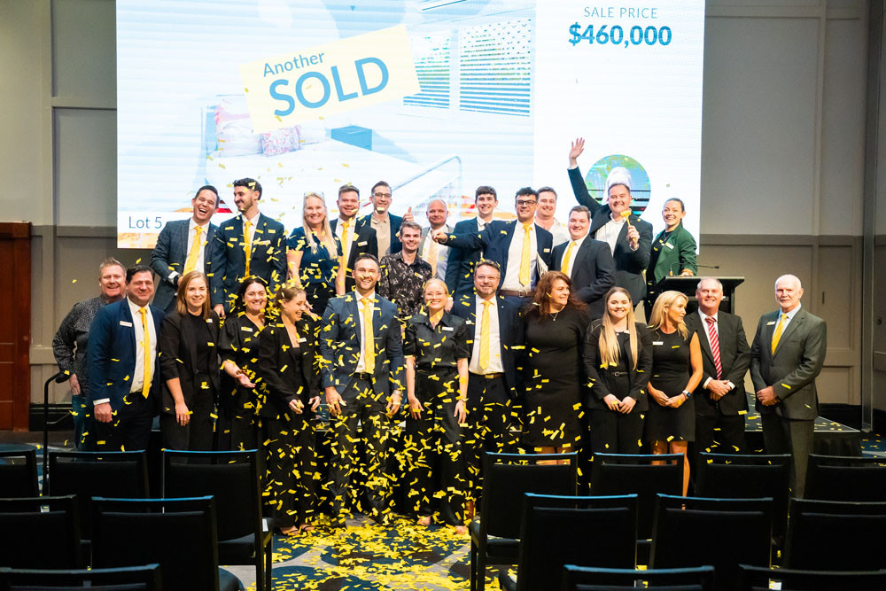 The Ray White Cairns team celebrate their largest property auction to date. Pictures: Isabella Guzman Gonzalez