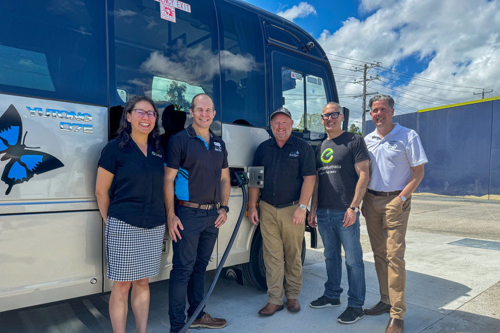 A Tropic Wings electric bus with (from left) EnergyAustralia green transport leader Joo Yin Ong, CaPTA operations and projects dirtector Michael Woodward, Tropic Wings general manager Colin Anderson, EnergyAustralia head of green transport Jack Kotlyar and Tourism Tropical North Queensland CEO Mark Olsen. Picture: Barbara Vichova/CaPTA Group.