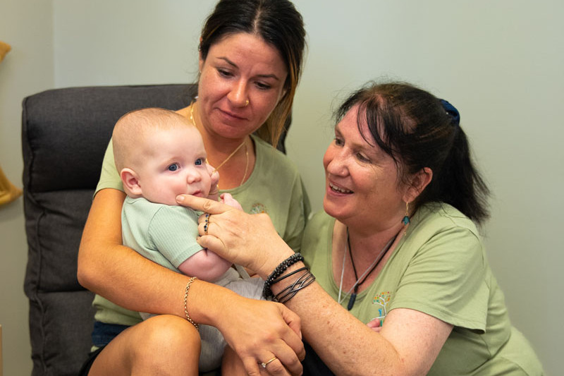 Small Steps Academy educators Karli Ross and Jodie Dolan with baby Logan Booy