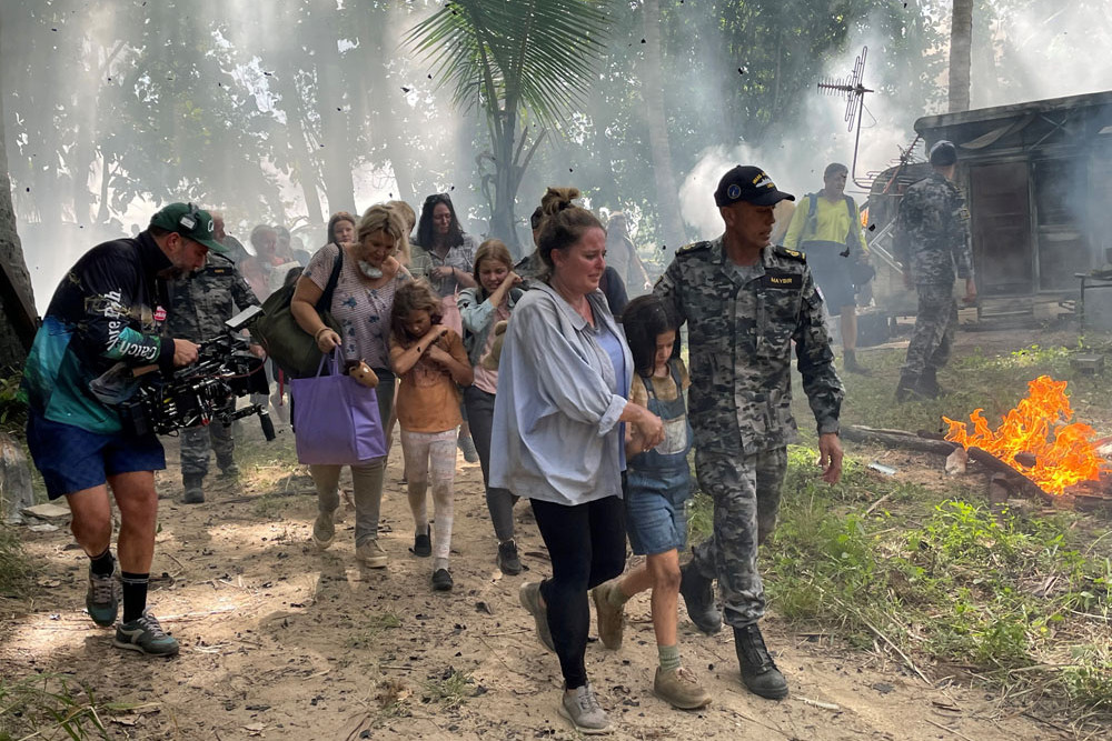 Chief petty officer Trevor Maybir, civilian actors Kamillia Rihani (centre front) and Ingrid Rihani and other Navy and civilian cast members for the production of a bushfire scene at East Trinity in the new advertising campaign for Navy careers. Picture: LCDR Sarah West