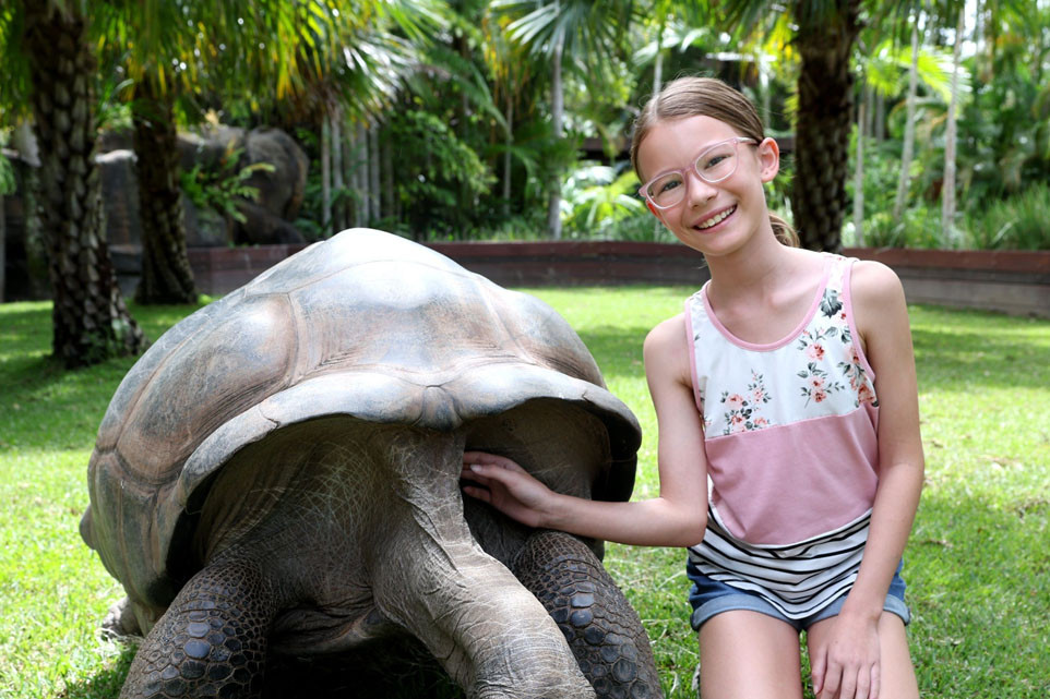 TAS student Summer Adams with a giant tortoise. Picture: Supplied
