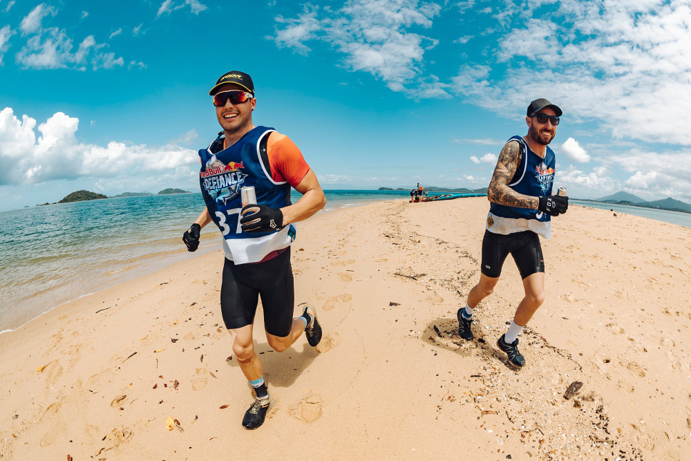 Competitors running along Dunk Island Spit - Photographer: Andy Green
