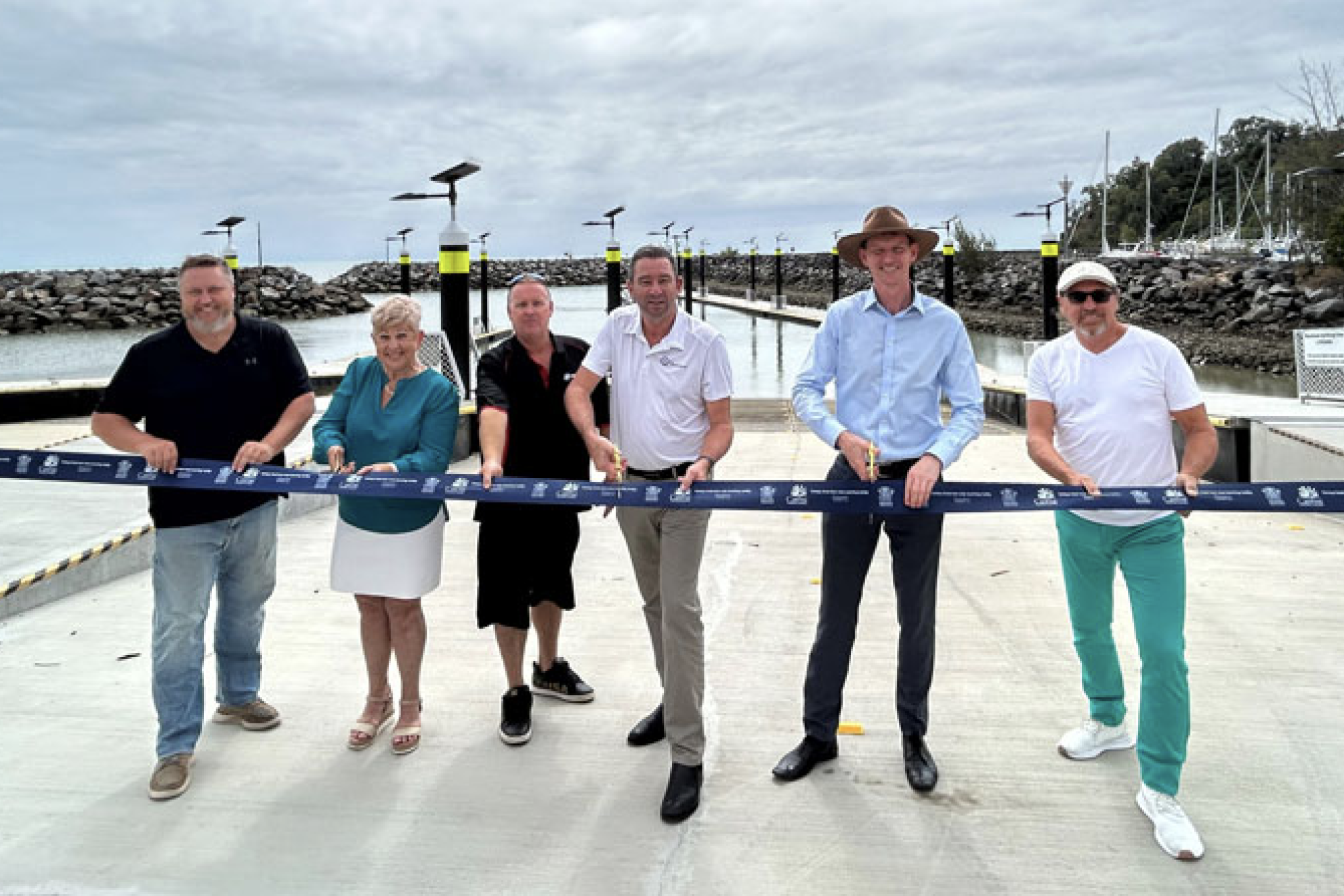 Cairns regional counclllors Brett Olds and Rhonda Coghlan, Paul Aubin of Carefish, Barron River MP Craig Crawford, Transport Minister Mark Bailey and Founder of Cairns and FNQ Fishing Group Dan Hammersley at the ramp opening.