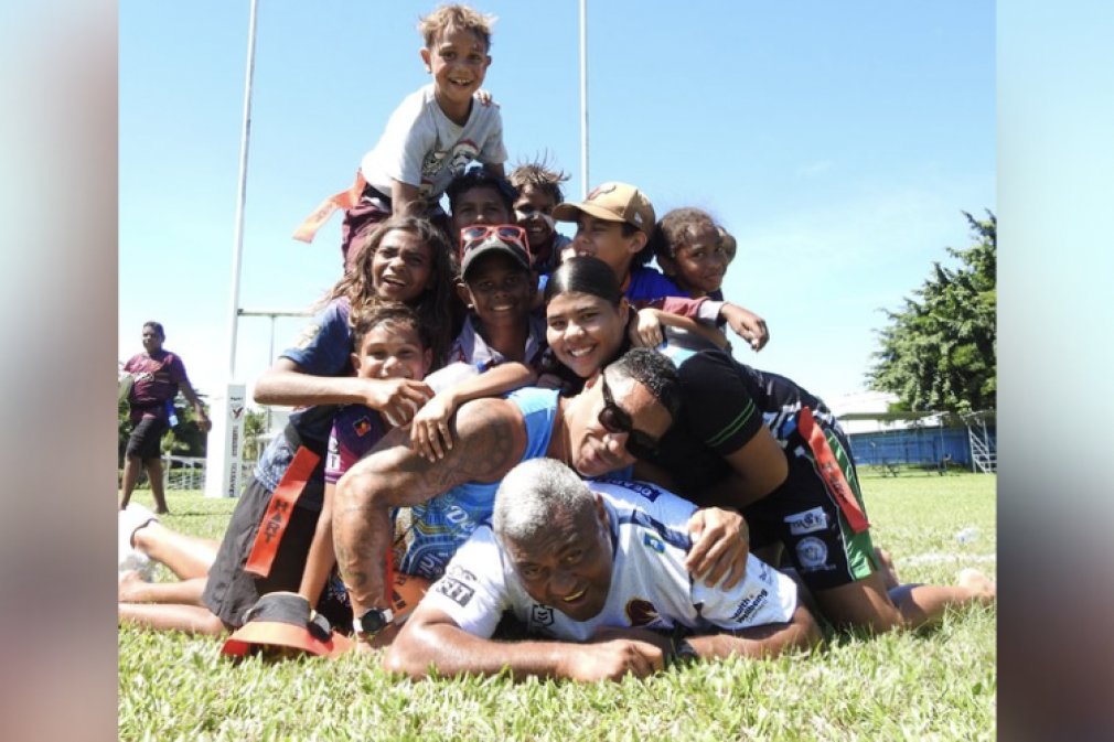 Rugby legends Petro Civoniceva and Will Tonga, who launched the anti-smoking campaign, were tackled into submission by Yarrabah kids. Picture: Supplied