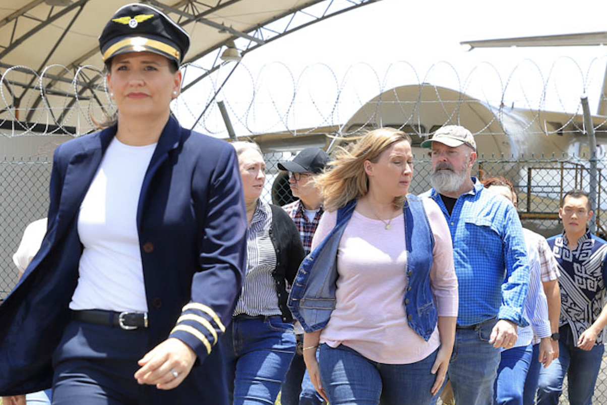 Captain Beverly Bass (played by Yasmin Croghan) leads the passengers off the plane into the unknown territory of Newfoundland. Picture: Paul Furse/Frontrow Foto