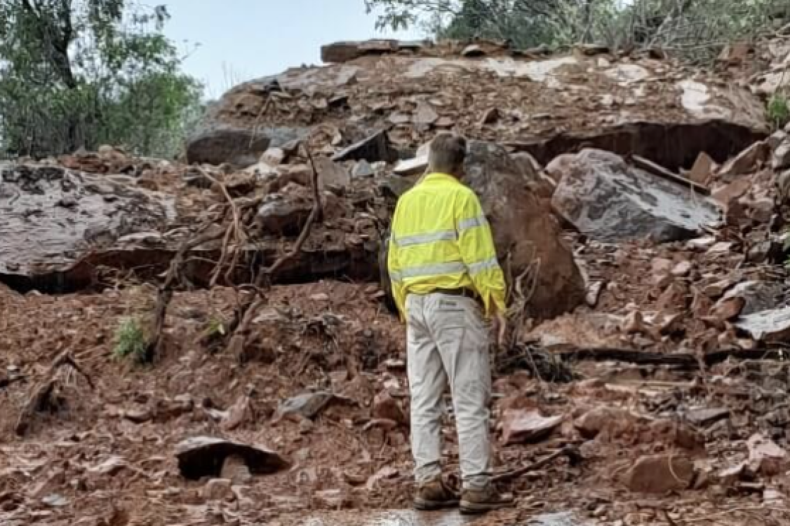 A Douglas Shire Council worker surveys the severe damage to roads on Cape Tribulation.