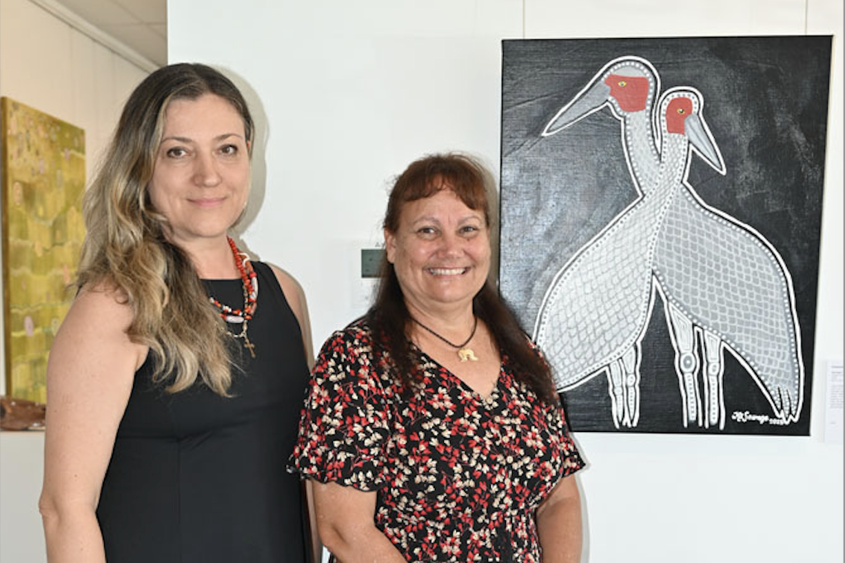 UMI Arts’ exhibition and gallery officer Aleksandra Kostic D and artist Kassandra Savage with the painting ‘Stronger together’ exhibited at the You & Me exhibition. Picture: Isabella Guzman Gonzalez