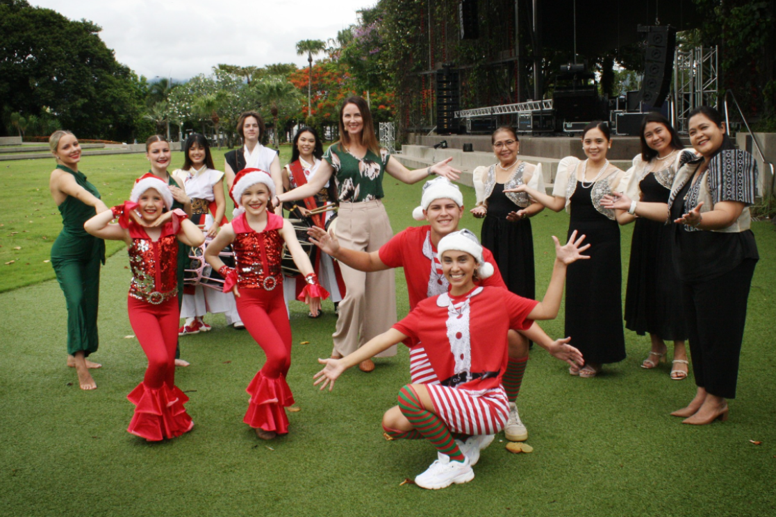 Cairns Mayor Amy Eden (centre) with some of the performers from FNQ Dance Academy, drummers from Drum Infinity Mugendai and members of the Filipino Community Choir, who will part of Carols in the Park on Sunday.