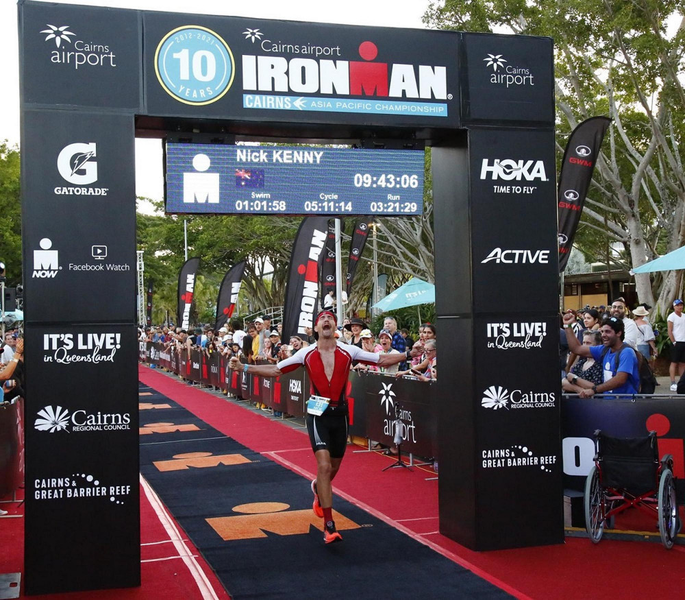 Nick Kenny celebrating finishing under his target time of 9hr45 at 2021 IRONMAN Cairns - Photo FinisherPix