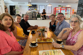 Douglas Shire Council Deputy Mayor Lisa Scomazzon, Cr Peter McKeown and Mayor Michael Kerr with locals at Temptations Cafe in Mossman