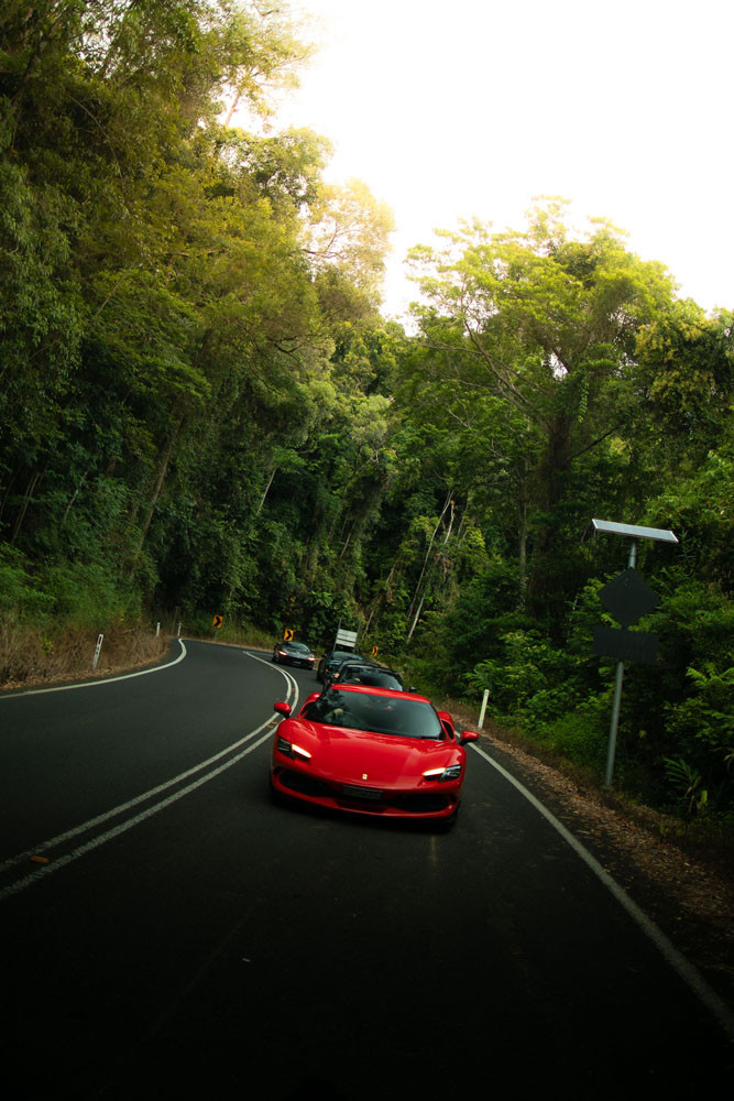 A Ferrari 296 GTB leads a convoy on the Rex Range.