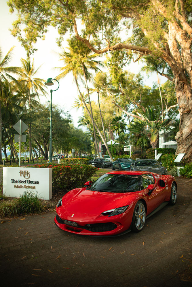 The $600,000 Ferrari 296 GTB parked at The Reef House Adults Retreat.