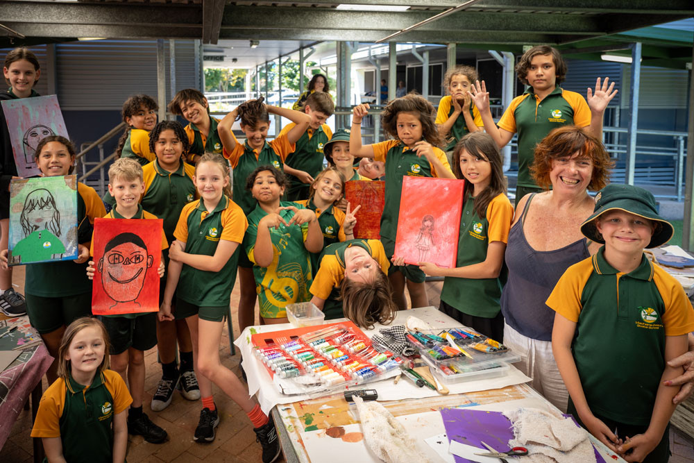 Machans Beach State School students working on their self-portraits with Marita.