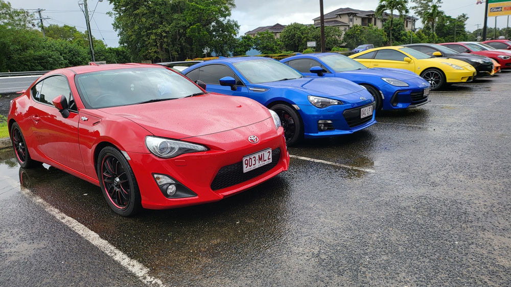 A line-up of Toyota 86s and Subaru BRZs.