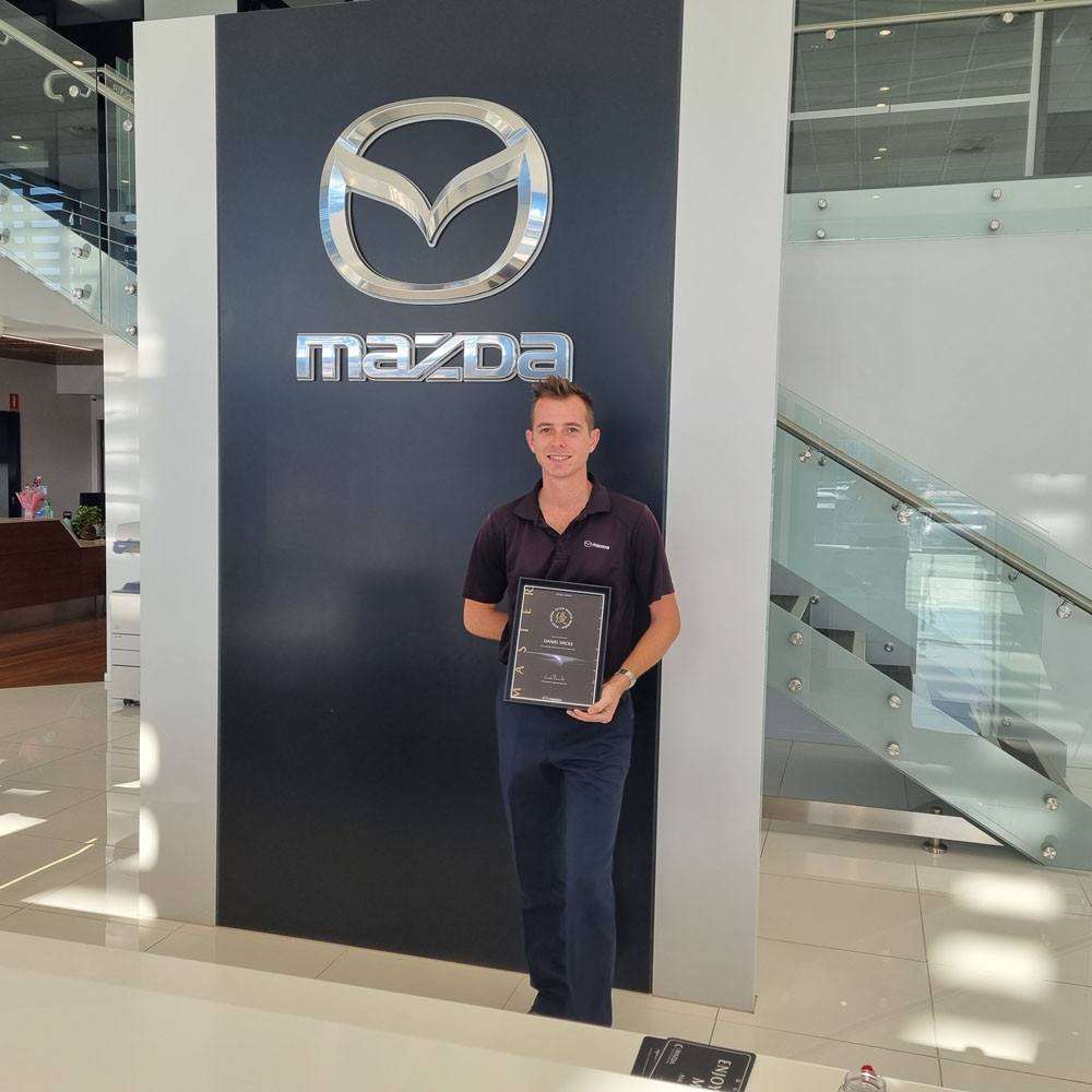 Daniel Wicks with his Mazda Guild Master Status award.