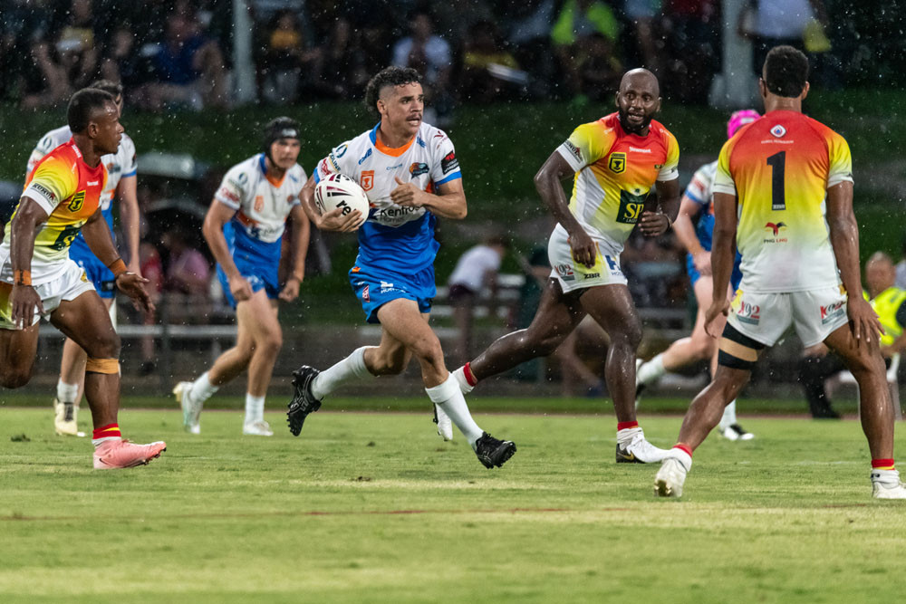 Travis Cornthwaite giving his all on the oval in the trial match against the PNG Hunters. Pictures: Chris Robson